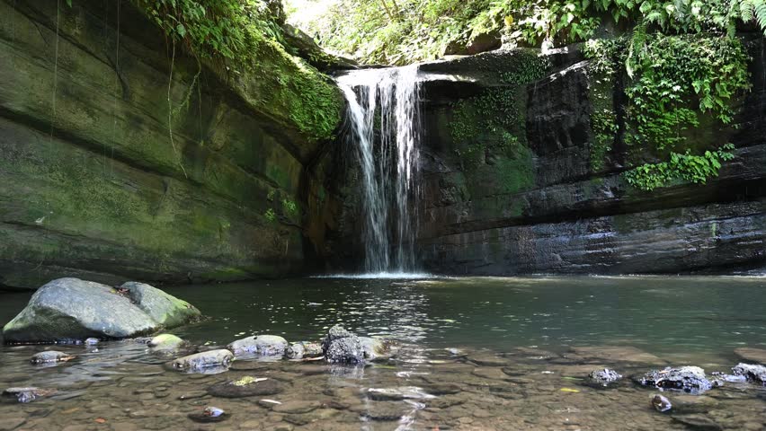 View of Wanggu Waterfall, water flowing from the top, in New Taipei City, Taiwan.