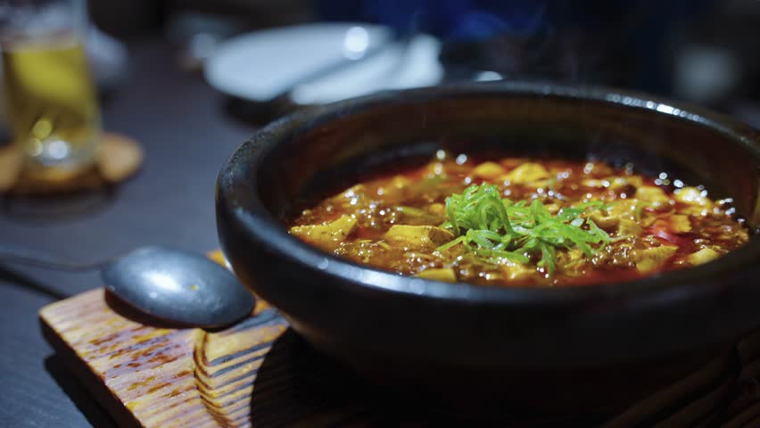 Boiling Delicious Mapo Tofu, Spicy Chinese Dish with Chili Oil, Tofu and Meat