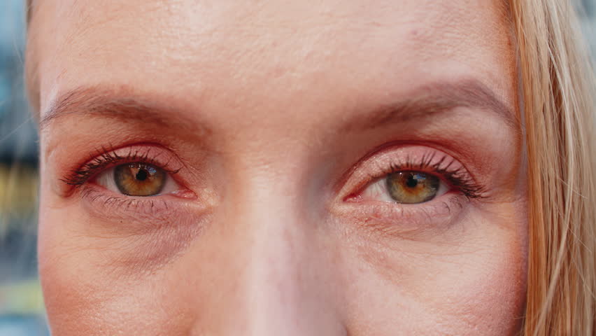 Closeup macro portrait of natural mature beautiful woman