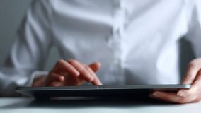 User reviews data on a tablet while interacting with digital icons in an office setting during the day. - Powered by Shutterstock - Get 15% off with code: PIKWIZARD15