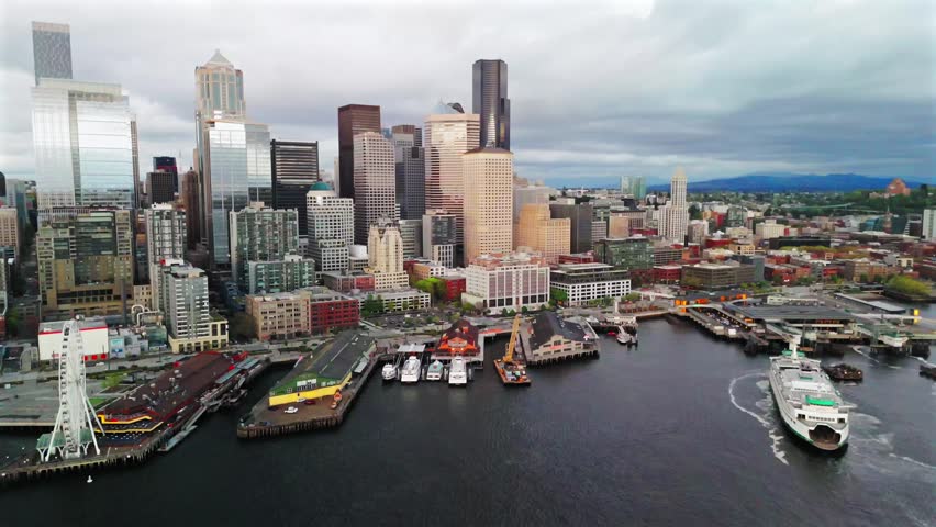 Seattle skyline waterfront ferris wheel harbor cloudy sky