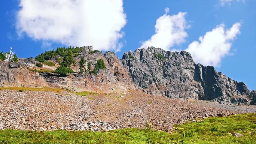 views from the challenging but rewarding Pinnacle Peak Trail in the Tatoosh Range of Mount Rainier National Park, Washington State. This footage captures the rugged, rocky landscape, alpine meadows, a