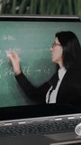 Distance learning, online schooling. close-up of laptop screen. schoolgirl watching online tutorial video lesson with teacher's explanations and making notes in notebook. studying online at home. - Powered by Shutterstock - Get 15% off with code: PIKWIZARD15