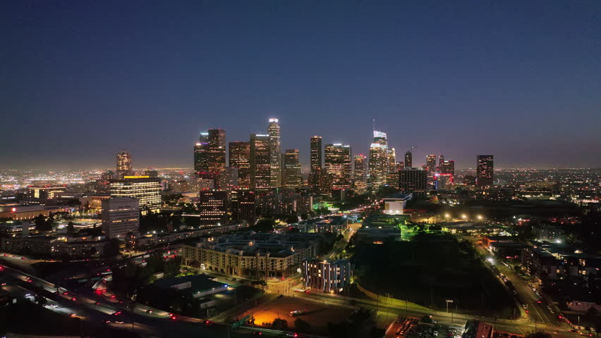 Los Angeles night aerial motion. Downtown Los Angeles lights. Los Angeles at night panorama. Los Angeles city skyline at night.