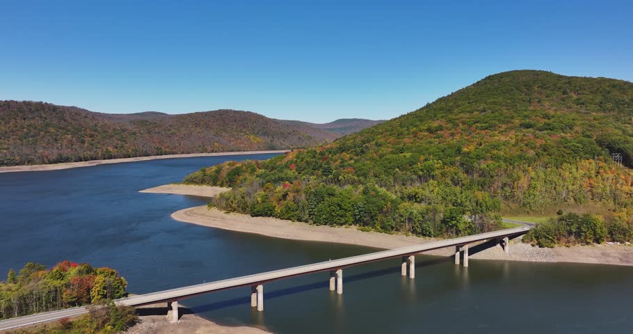 Autumn aerial video of the bridge of the Cannonsville Reservoir, Delaware County, NY, NYC DEP water supply, October 2025.