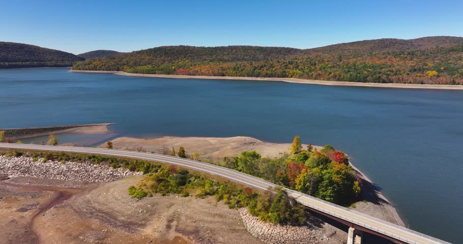 Autumn aerial video of the bridge of the Cannonsville Reservoir, Delaware County, NY, NYC DEP water supply, October 2025.