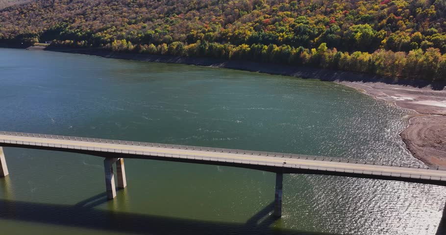 Autumn aerial video of the bridge of the Cannonsville Reservoir, Delaware County, NY, NYC DEP water supply, October 2025.