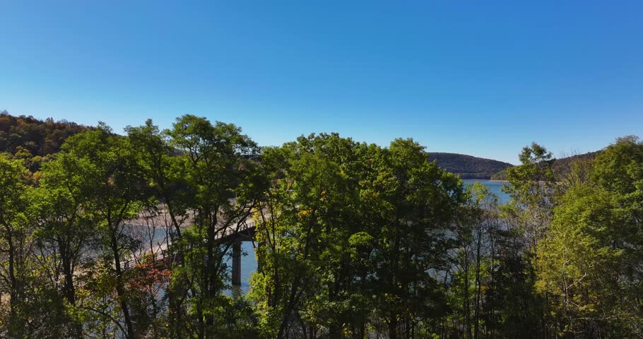 Autumn aerial video of the bridge of the Cannonsville Reservoir, Delaware County, NY, NYC DEP water supply, October 2025.