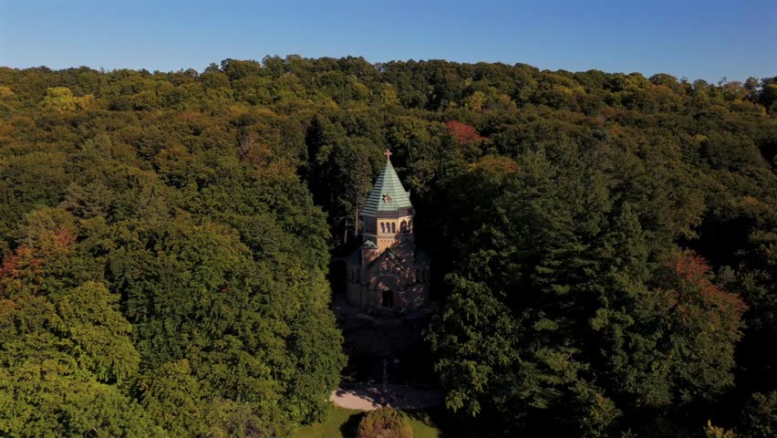 Peaceful autumn aerial scenery of Votive Chapel Berg Starnberg Lake Bavaria Germany famous Bavarian landmark dedicated to King Ludwig II near Munich surrounded by colorful nature