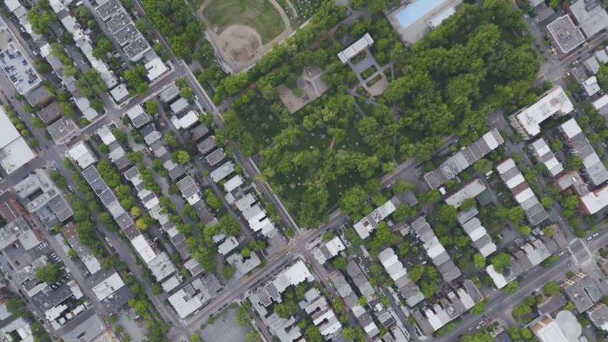 Aerial view of Parc Pere Marquette and La Baraque in Montreal with city blocks and Mount Royal. g.