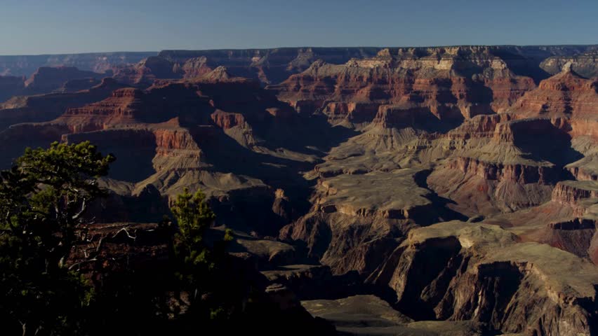 Panoramic wide angle view of the massive rock formations and deep valleys inside Grand Canyon National Park in Arizona