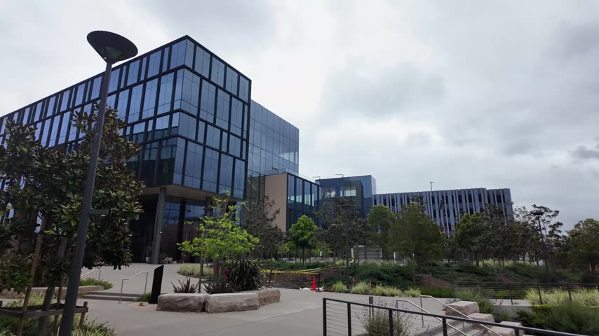 Modern architecture of a medical laboratory research building with a landscaped exterior garden in the biotech hub of South San Francisco, California on a cloudy day