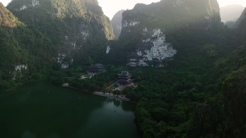 Aerial view of trang an temples among limestone karst mountains and lake in ninh binh, vietnam