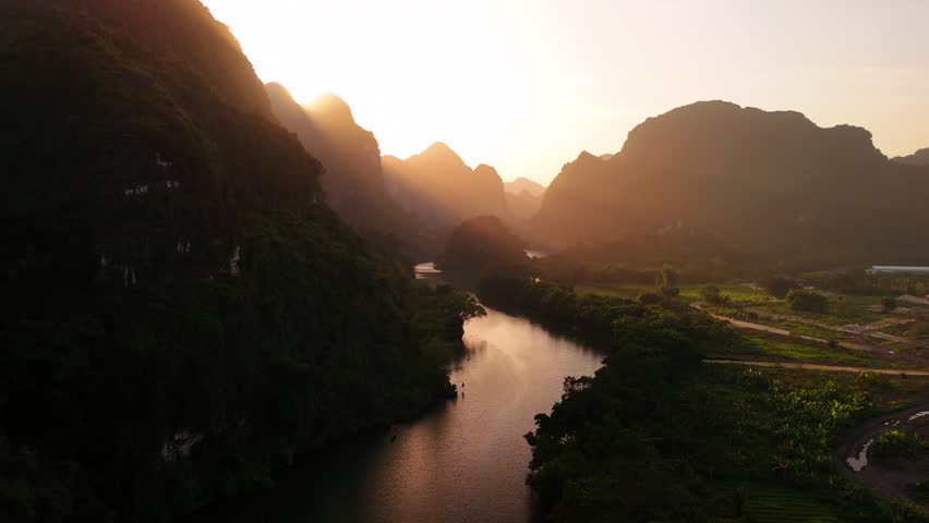 Aerial view of river and mountains in ninh binh, vietnam with golden sunset
