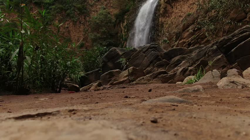 Cascada el Salto del Nogal, Tapalpa, Jalisco, Mexico - A Waterfall Cascades Down Rocky Cliffs Surrounded by Lush Greenery - Medium Shot