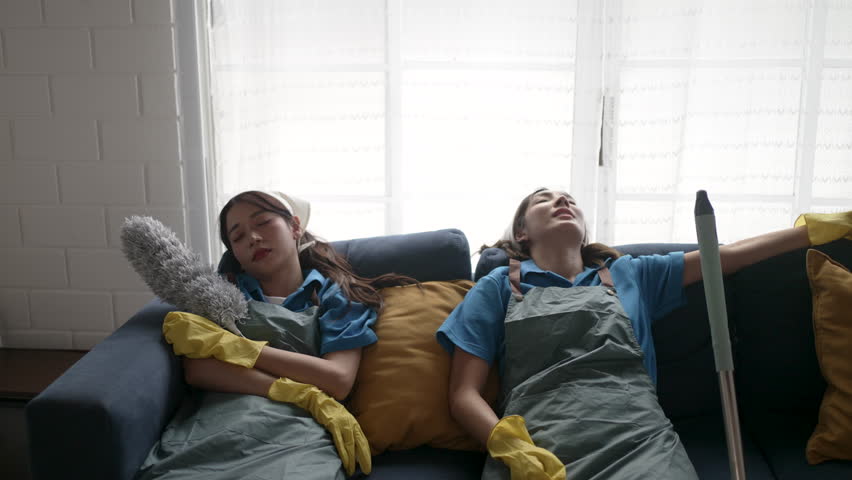 Housekeepers are cleaning a living room. Occupation, Blue collar worker.