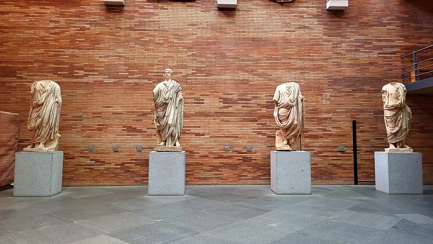 Roman Art Museum of Mérida, Spain.,Ancient Roman stone sculptures in a museum. Rome consuls and patricians in tunics. Roman busts. Roman Empire culture.
