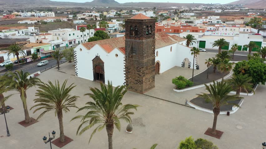 Aerial view of a traditional church in La Oliva, Fuerteventura, Spain. Peaceful setting with cultural and architectural appeal.