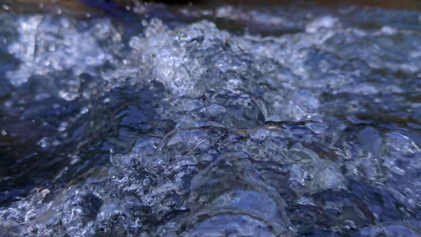 Close up video of clear river water flowing
