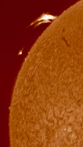 Extreme Close Up of Solar Flares and Prominences Erupting from the Surface of the Sun with Detailed Photosphere Texture and Intense Plasma Energy Activity in Deep Space Astronomy Concept. sstkVertical