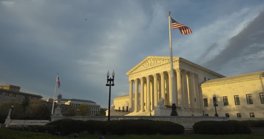 US Supreme Court with American Flag Waving