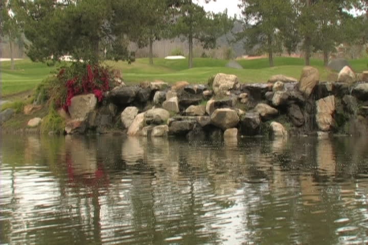 Beautiful Golf course scene with water and birds ambiance.