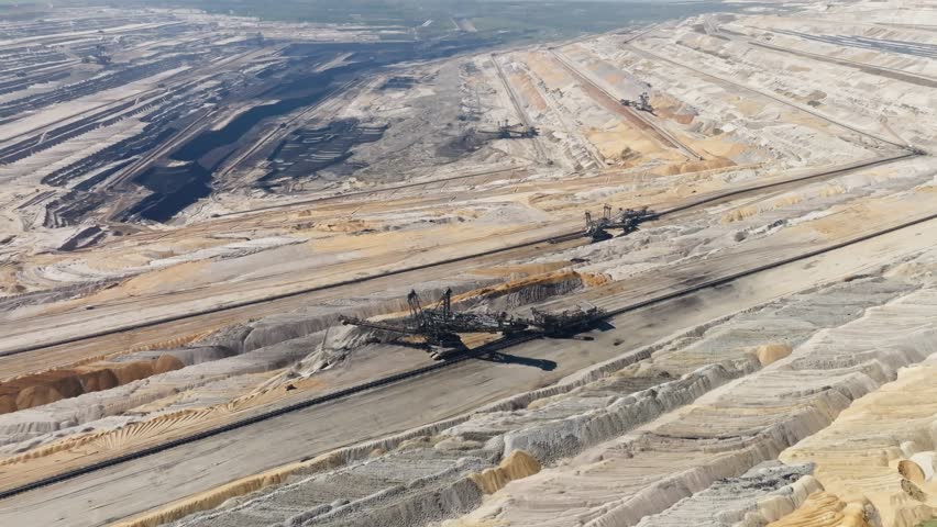 Aerial heavy machine moving in in a vast open cast lignite coal mine