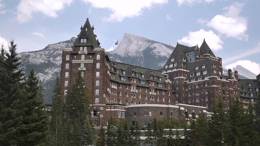 Luxury Historic Fairmont Banff Springs Hotel with majestic Mount Ruddle in the background, Banff National Park, Alberta, Canada. Road trip in Canada. Rocky mountains. 