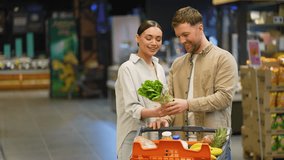 Happy couple choosing fresh lettuce in supermarket - Powered by Shutterstock - Get 15% off with code: PIKWIZARD15