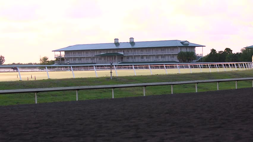 Wide shot of house on a horse racetrack