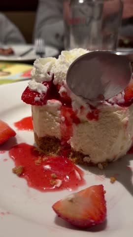 Cheesecake dessert scooping with a spoon
