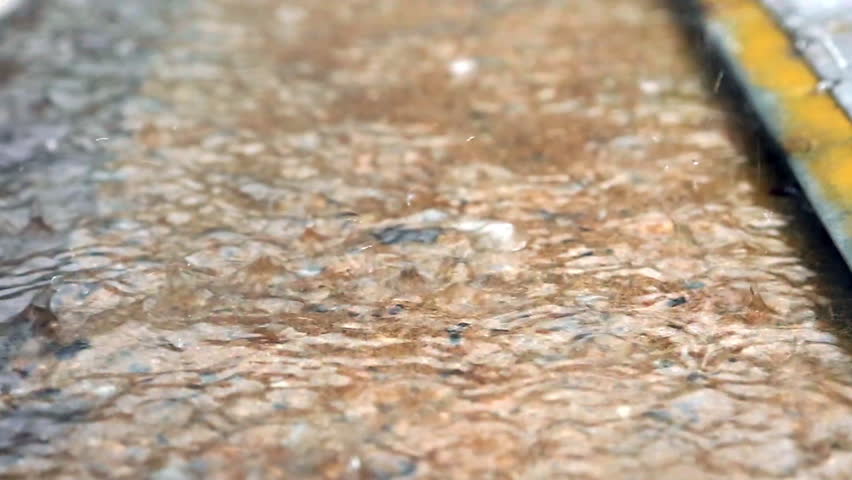 Seoul Korea rain water stepping. A close-up video footage of a child
