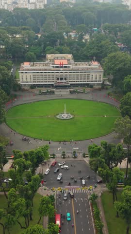 Vertical screen, Vietnam, Ho Chi Minh Aerial View Reunification Palace Lawn Fountain, Colonial Government Building Framed By Circular Green Park, Scattered Visitors On Paths, Cars