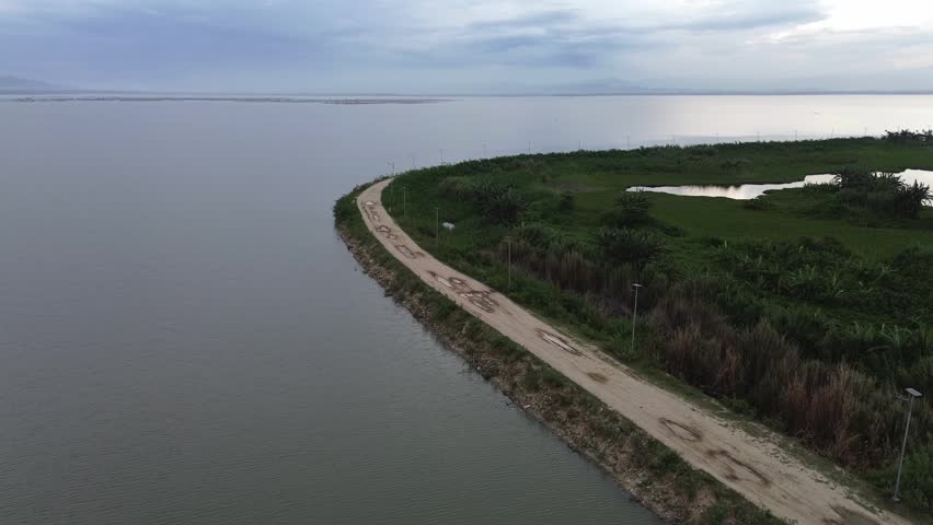 Aerial View of a Coastal Road and Water