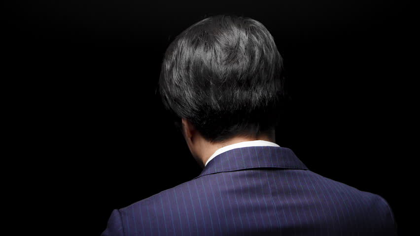 A business image of a young man in a business suit.