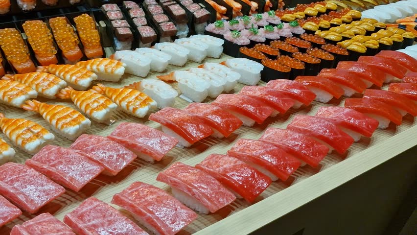 Different Types of Sushi Meals on Display in Traditional Japanese Shopping Street, Close Up