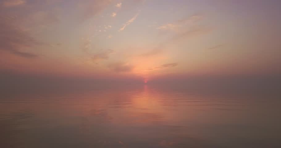 Flying over the sea during sunset, beautiful orange sunset