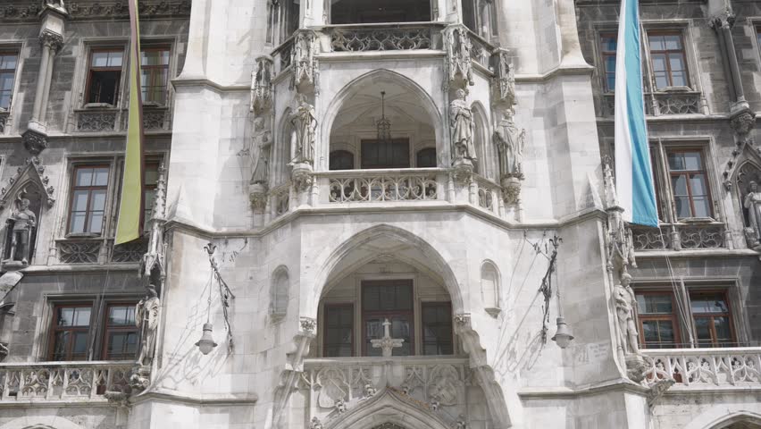 Impressive architecture of the new town hall with its famous glockenspiel at marienplatz