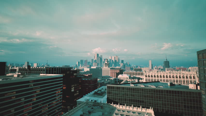 city skyline from rooftop at dusk, cinematic teal tones, snowdusted roofs, distant glass towers, empty terraces, urban photographer scouting composition