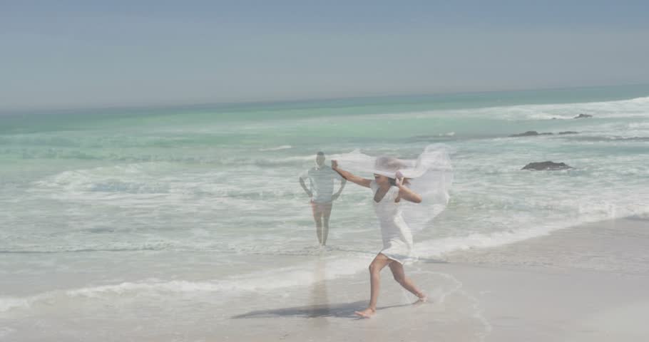 Woman lifting translucent scarf, running and leaping along wet sand, performing for companion. Beach, veil, fabric, motion, doubleexposure, ocean, turquoise