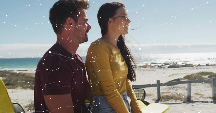 Man and woman sitting on yellow convertible hood, HUD panels sweeping, visualizing data over couple. Coastal, beach, horizon, ocean, sunny, digital, visualization