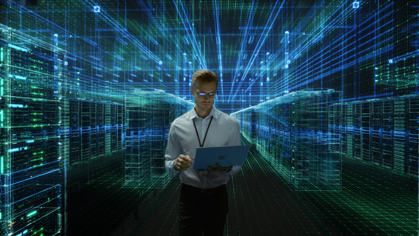 IT Engineer Walks Through Digtitized Data Center, Using a Laptop Amid Glowing Server Racks, Holographic Network Lines and Immersive Blue Cyber Infrastructure. Activating AI Analysis
