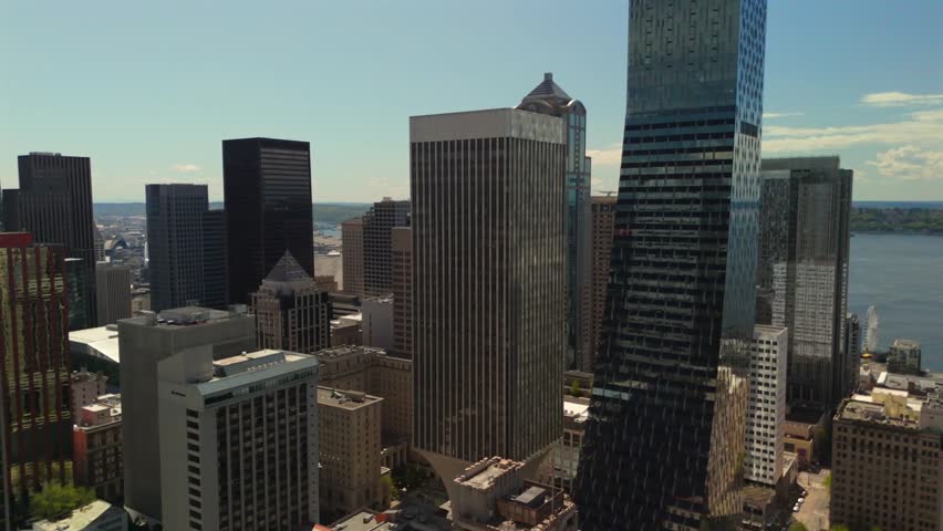 Seattle downtown aerial between skyscrapers with distant landscape