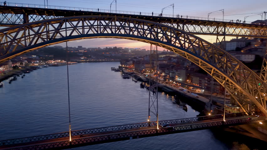 Aerial View of illuminated Porto city. Dom Luis bridge, Portugal