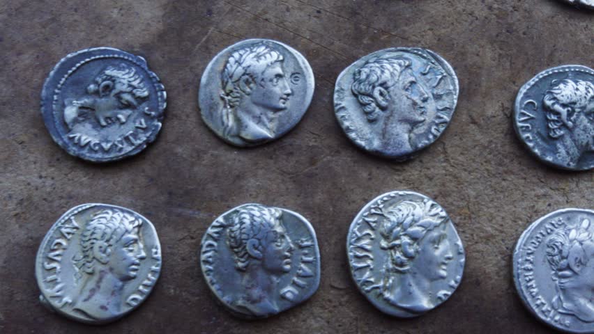 Antique Roman Silver Coins on Table