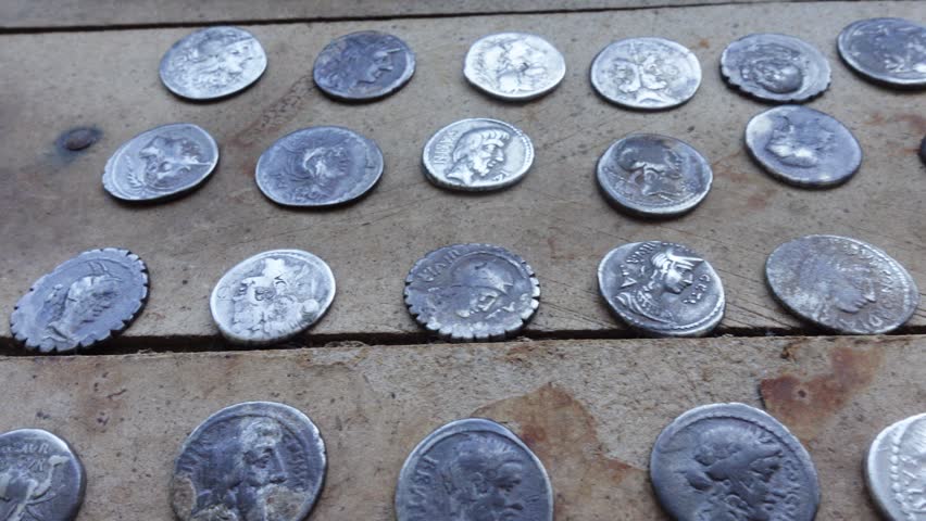Antique Roman Silver Coins on Table