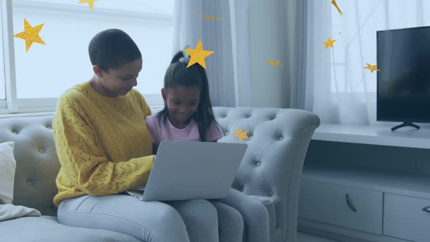 Adult tapping laptop and guiding girl on sofa, golden stars growing around heads during learning. Parent, child, bonding, home, screen, education, interaction