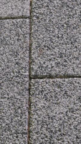 Gray stone tile walkway in a public city park