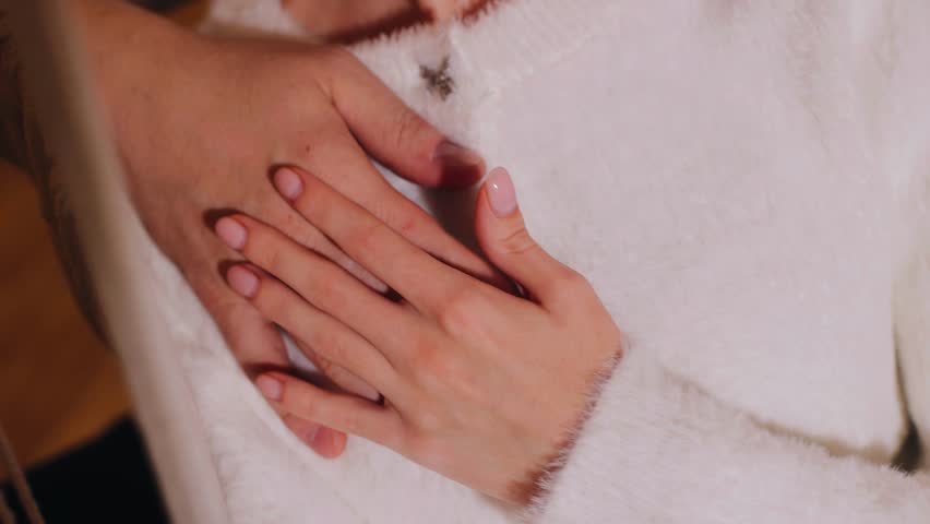 A man and a woman gently touch each other