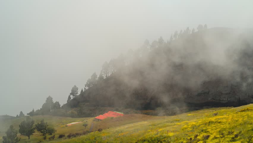 Clouds Flowing Over Red Roof House and Volcanic Hill Tenerife 4K Timelapse